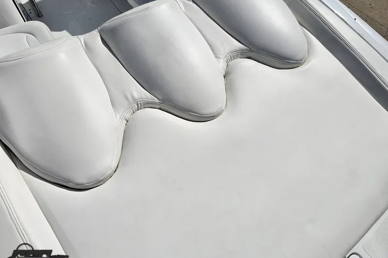 Slide: The Image of White leather seating on a 2003 Baja 342 boat, showcasing sleek design and comfort. - 35