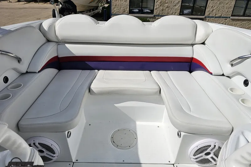 Slide: The Image of 2003 Baja 342 boat interior with white seating and colorful accents. - 74