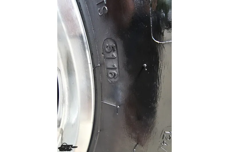 Slide: The Image of Close-up of a Baja 342 tire from 2003, showing the number 5116. - 88