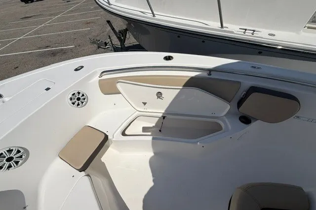 Slide: The Image of 2018 Tidewater 220 LXF boat interior with seating and storage compartments. - 21