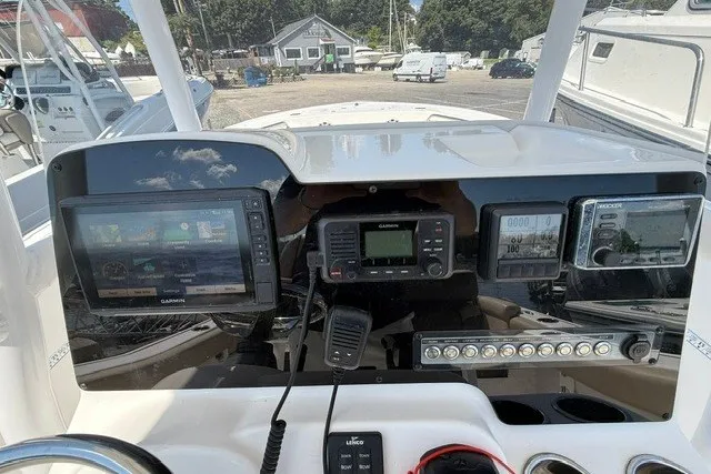 Slide: The Image of Dashboard of a 2018 Tidewater 220 LXF boat with Garmin navigation systems. - 15