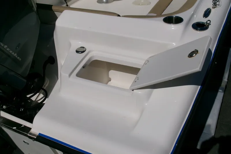 Slide: The Image of Key West 203 DFS 2020 boat with open storage compartment and motor detail. - 19