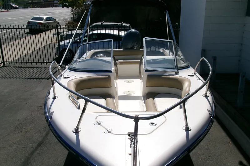 Slide: The Image of 2020 Key West 203 DFS boat with open bow seating, parked outdoors. - 25