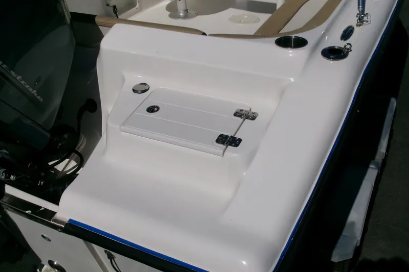 Slide: The Image of 2020 Key West 203 DFS boat deck with storage compartment and cup holders. - 18