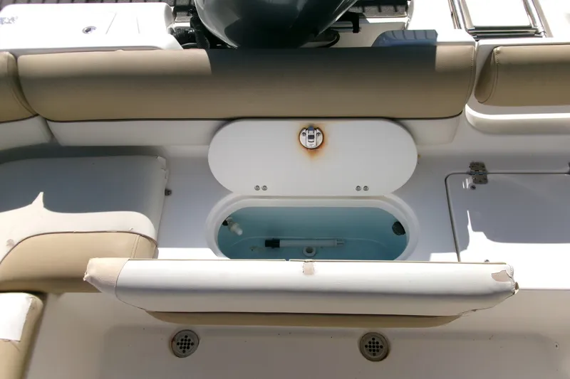 Slide: The Image of 2020 Key West 203 DFS boat interior with seating and storage compartment. - 16