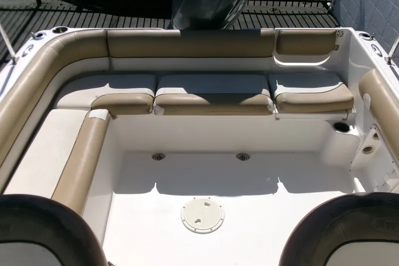 Slide: The Image of 2020 Key West 203 DFS boat interior with beige seating and white deck. - 13