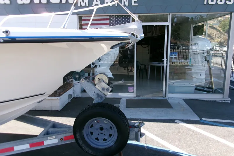 Slide: The Image of 2020 Key West 203 DFS boat on trailer outside marine shop. - 23