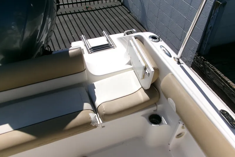 Slide: The Image of 2020 Key West 203 DFS boat interior with beige seating and ladder. - 14