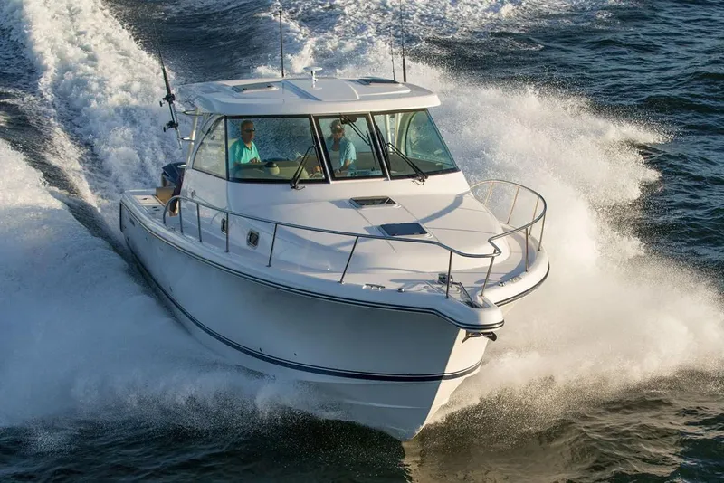 Slide: The Image of Manufacturer Provided Image: 2018 Pursuit OS 385 Offshore boat cruising on water. - 40