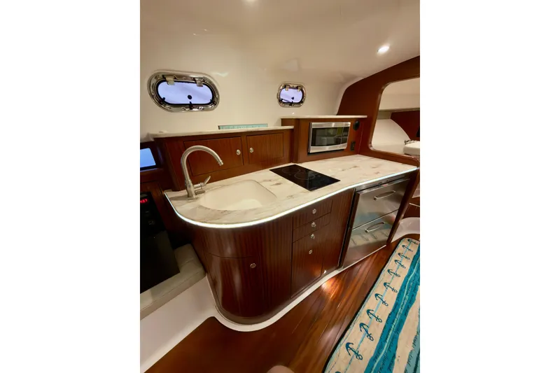Slide: The Image of Luxurious 2018 Pursuit OS 385 Offshore yacht interior with modern kitchen amenities. - 10