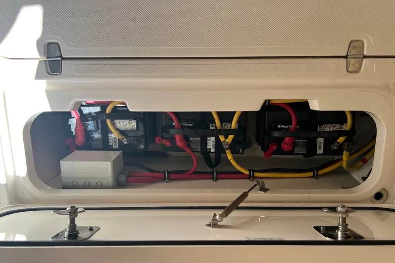 Slide: The Image of Battery compartment of a 2018 Pursuit OS 385 Offshore boat with wiring connections. - 33