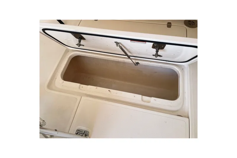 Slide: The Image of Open storage compartment on 2018 Pursuit OS 385 Offshore boat deck. - 36