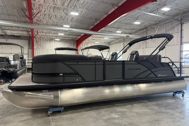 The Image of 2026 Sylvan X5 pontoon boat in a showroom with modern design and sleek features. - 1