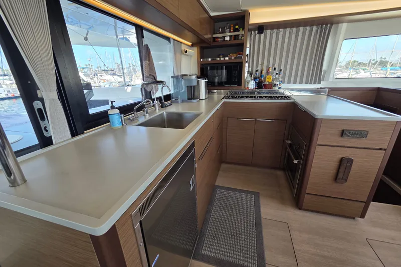 Slide: The Image of Modern kitchen interior of 2022 Lagoon 46 yacht with sleek countertops and appliances. - 26