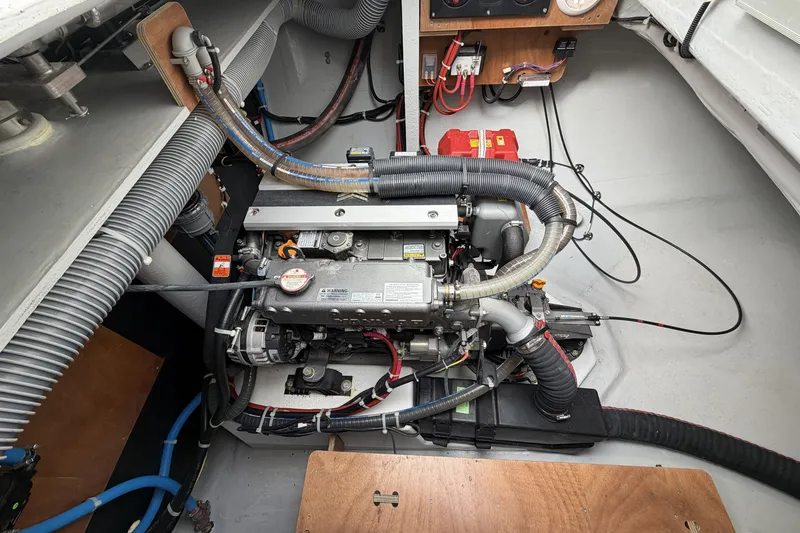Slide: The Image of Engine compartment of a 2022 Lagoon 46 catamaran, showcasing detailed mechanical components. - 44
