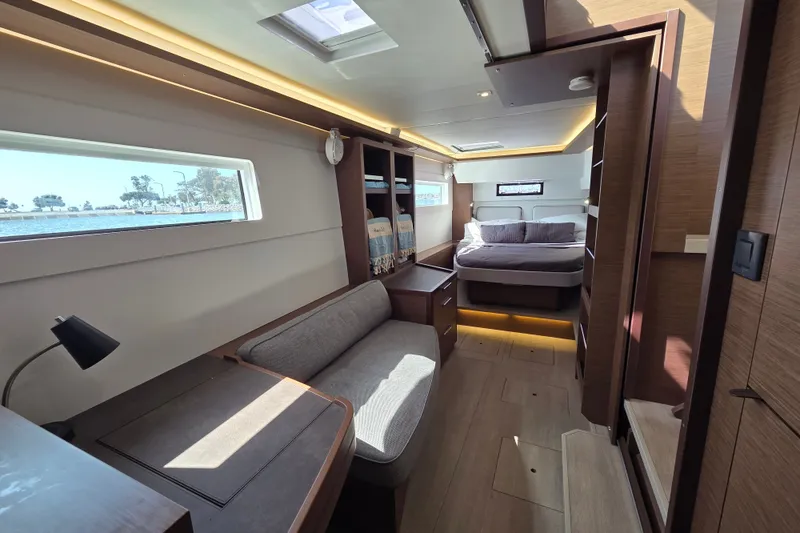 Slide: The Image of Luxurious interior of 2022 Lagoon 46 yacht with cozy seating and elegant bedroom. - 33