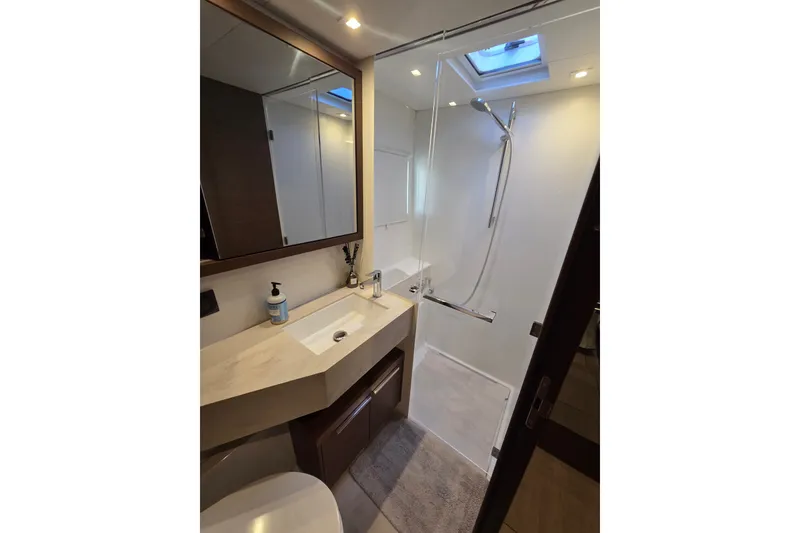Slide: The Image of Modern bathroom in 2022 Lagoon 46 yacht with sleek shower and vanity. - 43