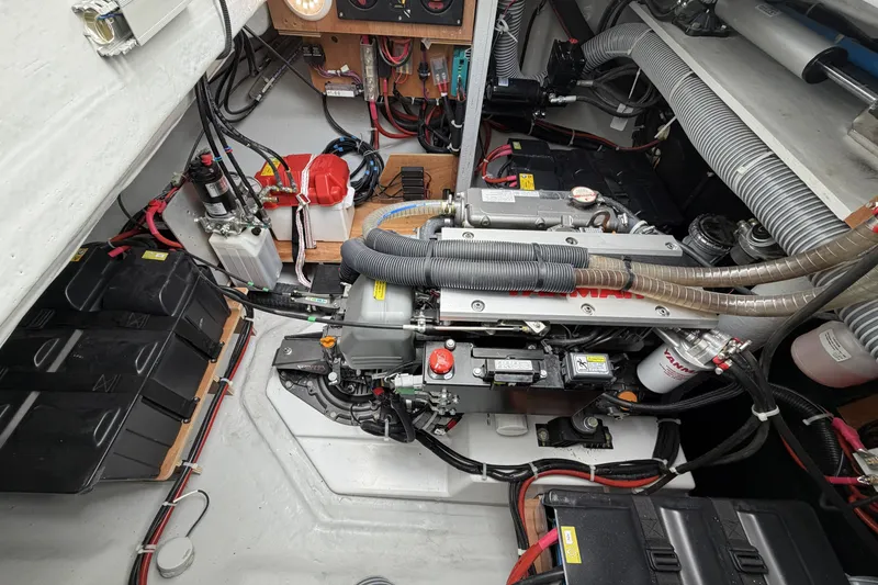 Slide: The Image of Engine room of a 2022 Lagoon 46 yacht, showcasing mechanical components and wiring. - 45