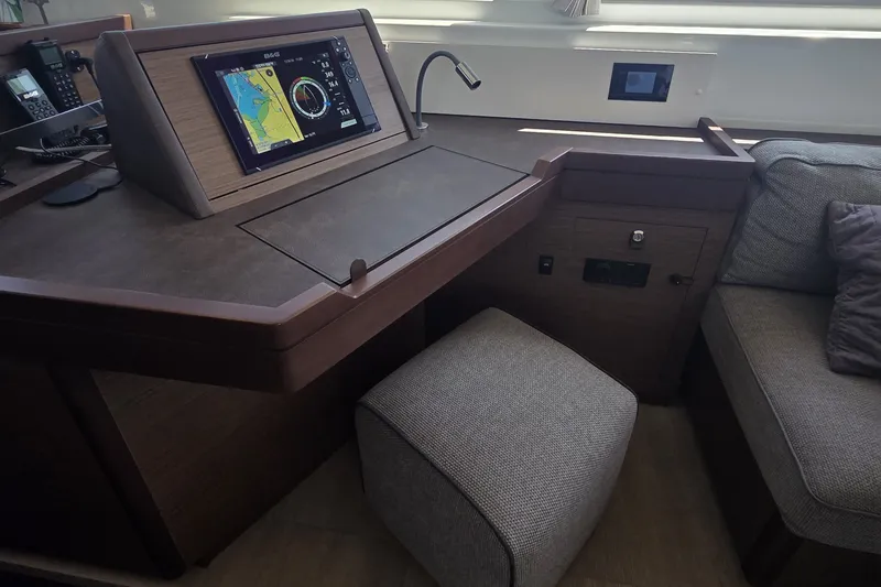Slide: The Image of Interior of 2022 Lagoon 46 yacht with navigation station and seating area. - 22