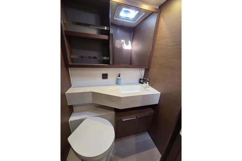 Slide: The Image of Modern bathroom interior of 2022 Lagoon 46 yacht, featuring sleek sink and storage. - 37