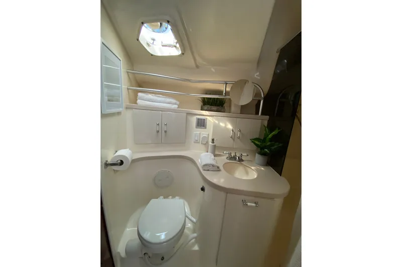 Slide: The Image of 1997 Mainship 40 Sedan Bridge bathroom with modern fixtures and natural lighting. - 17