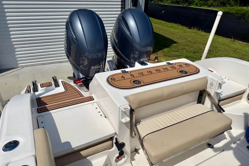 Slide: The Image of 2017 Sea Fox 266 Commander boat with dual engines and beige seating. - 23
