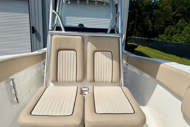 Slide: The Image of 2017 Sea Fox 266 Commander boat with beige cushioned seating and sleek design. - 14