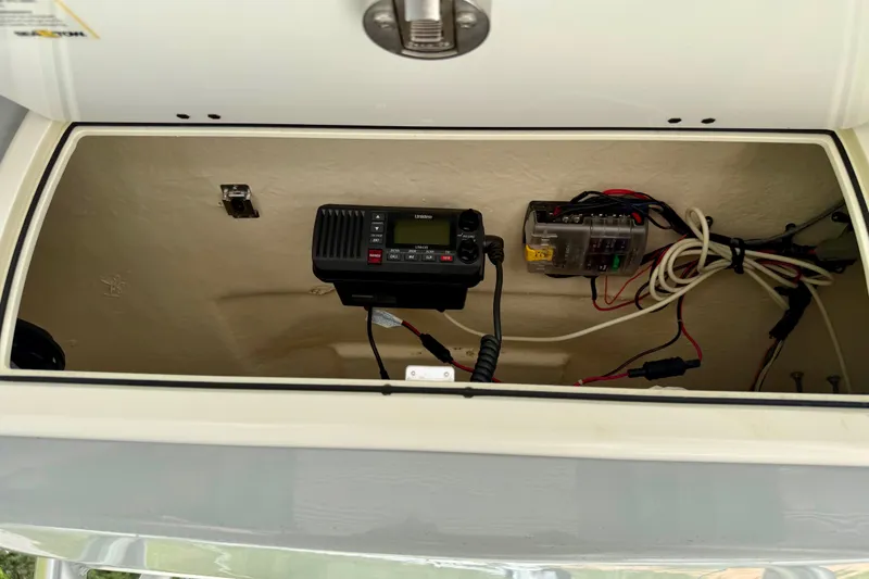 Slide: The Image of 2017 Sea Fox 266 Commander electronics compartment with radio and wiring. - 16