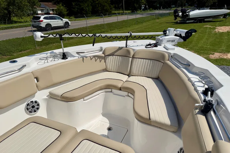 Slide: The Image of 2017 Sea Fox 266 Commander boat with beige seating and fishing rod holders. - 15