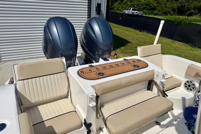 Slide: The Image of 2017 Sea Fox 266 Commander boat with dual Yamaha engines and beige seating. - 24
