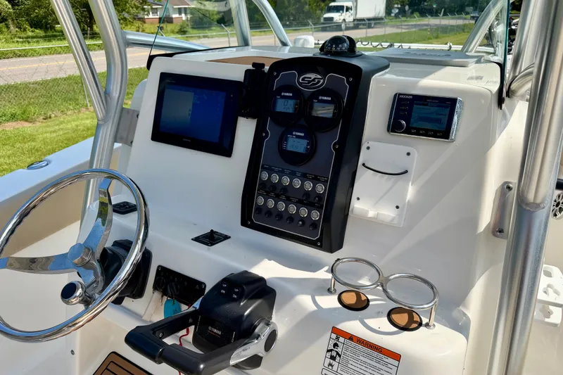 Slide: The Image of 2017 Sea Fox 266 Commander boat dashboard with steering wheel and electronic controls. - 20