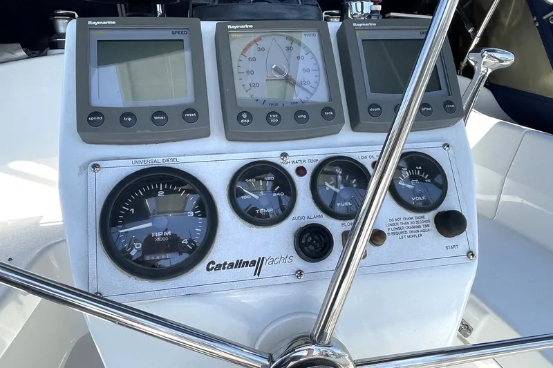 Slide: The Image of Control panel of a 2004 Catalina 350 yacht with navigation instruments. - 16