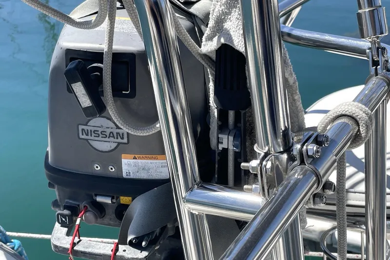 Slide: The Image of Outboard motor on a 2004 Catalina 350 sailboat, featuring Nissan branding. - 23