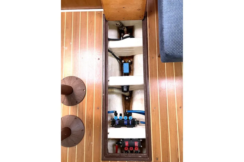 Slide: The Image of 2004 Catalina 350 yacht interior showing underfloor wiring and components. - 13