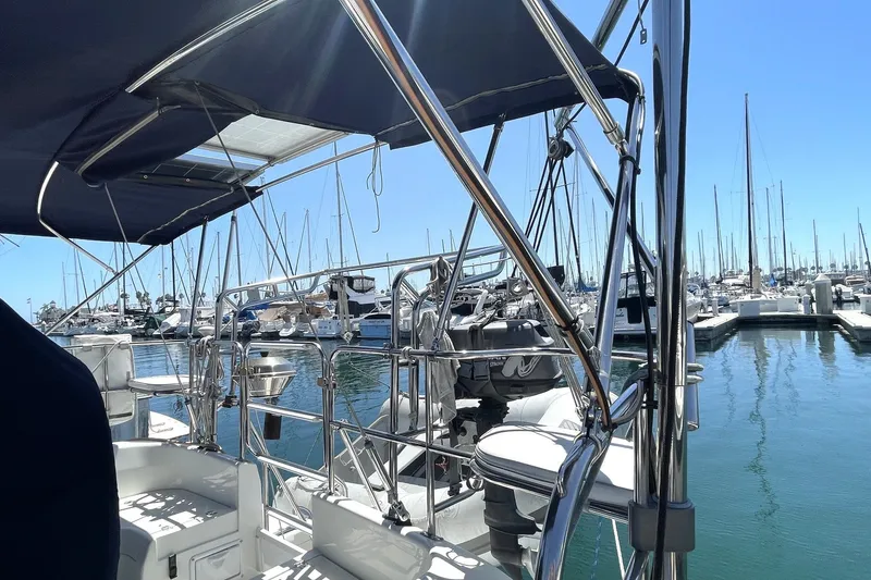 Slide: The Image of Sailboat Catalina 350, 2004 model, docked at marina with clear blue sky. - 19