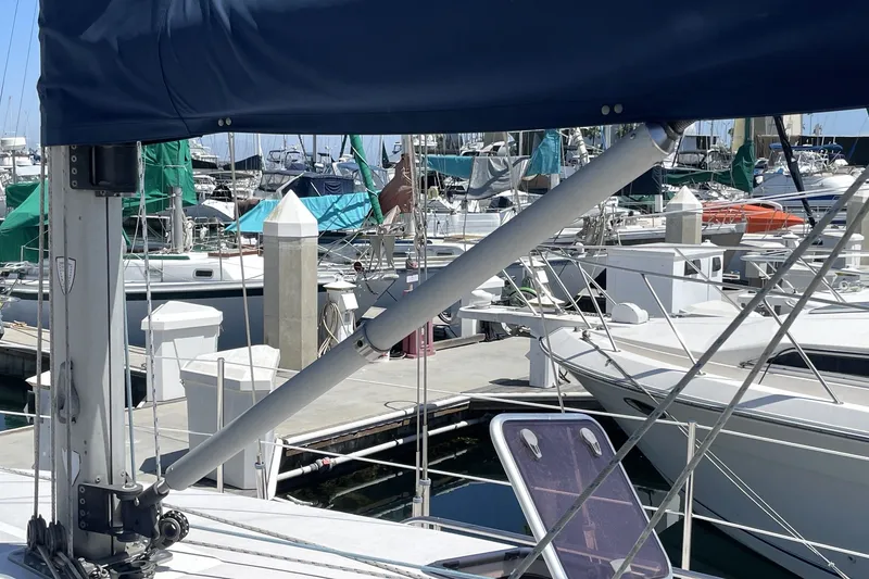 Slide: The Image of Catalina 350 sailboat from 2004 docked at a marina with other boats. - 21
