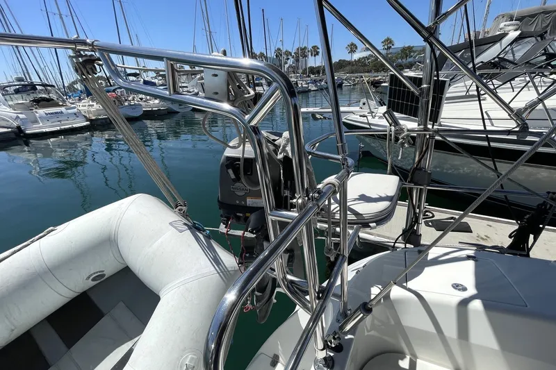 Slide: The Image of Sailboat Catalina 350 (2004) docked, featuring stainless steel rigging and inflatable dinghy. - 24