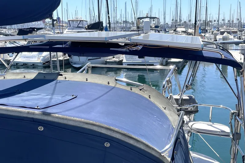 Slide: The Image of Catalina 350 sailboat, 2004 model, docked in marina with solar panels on deck. - 20