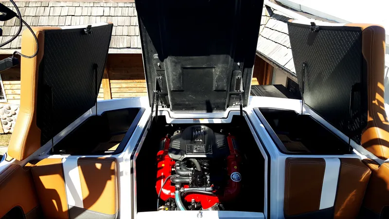 Slide: The Image of The engine compartment of a 2017 Super Air Nautique 210 with a red PCM engine is visible. - 14