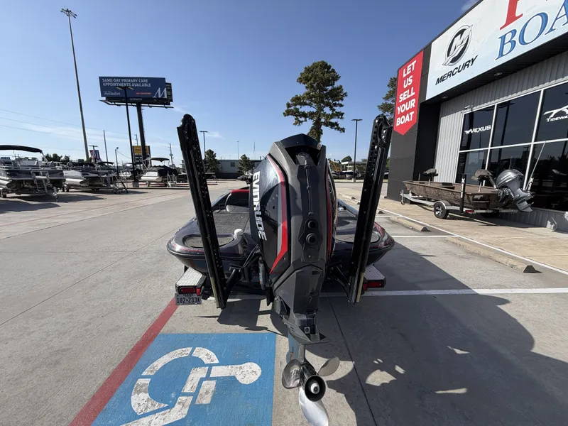 Slide: The Image of A 2018 Falcon F205 is parked, showing its outboard motor. It's in a dealership lot. - 11