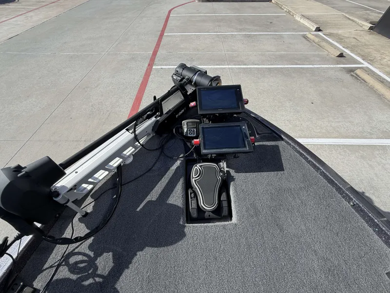 Slide: The Image of The image shows the cockpit of a 2018 Falcon F205 boat with two screens and controls. - 29