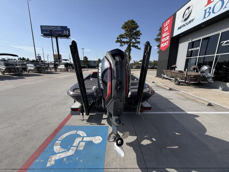 Slide: The Image of A 2018 Falcon F205 boat is parked in front of a boat dealership. - 9