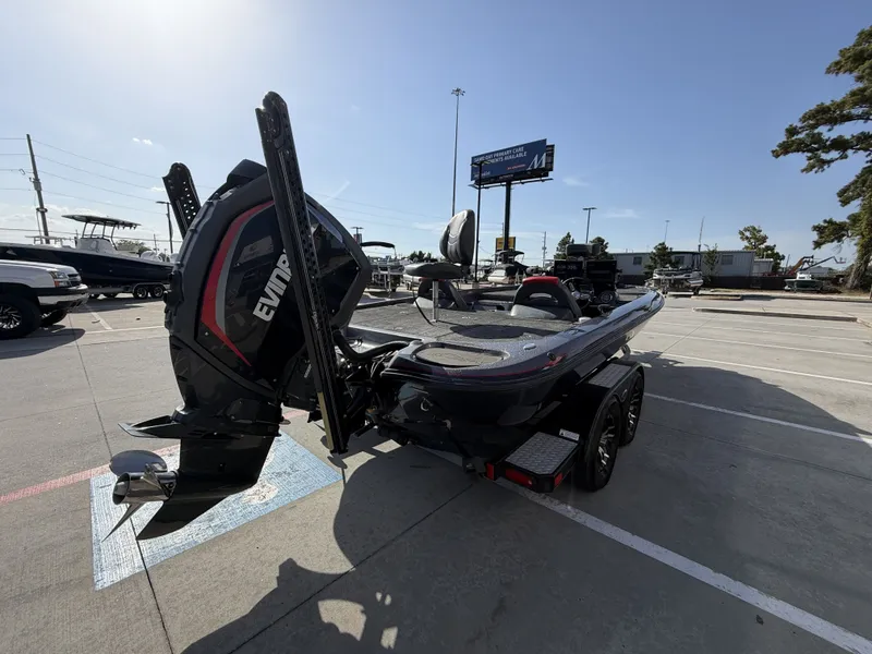 Slide: The Image of A 2018 Falcon F205 boat on a trailer in a parking lot. - 10