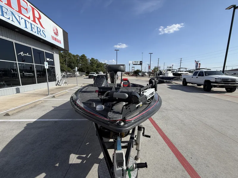 Slide: The Image of A 2018 Falcon F205 on a trailer outside a dealership building. - 5