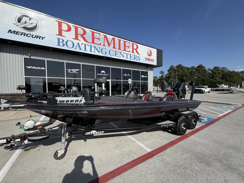 Slide: The Image of A 2018 Falcon F205 boat on a trailer outside a boating center. - 3