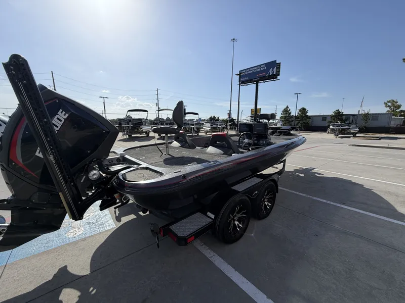 Slide: The Image of A 2018 Falcon F205 on a trailer in a parking lot. The sky is clear. - 8