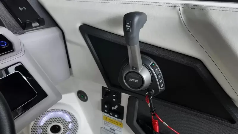 Slide: The Image of Close-up of the throttle lever on a Cobalt R4 Surf boat, surrounded by white upholstery. - 23