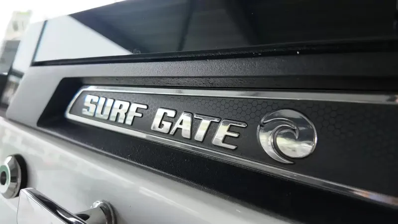 Slide: The Image of Close-up of the "Surf Gate" emblem on a Cobalt R4 Surf boat. - 28