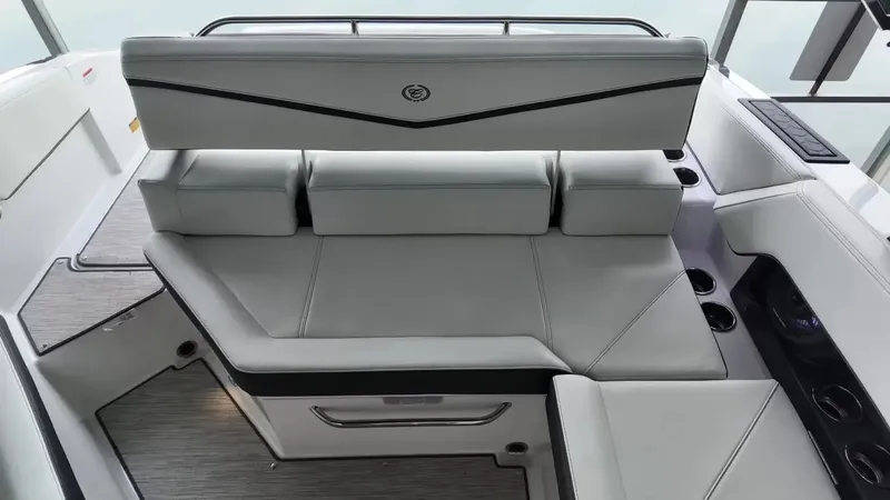 Slide: The Image of The image shows the luxurious interior of a Cobalt R4 Surf boat with sleek, light gray upholstery. - 45