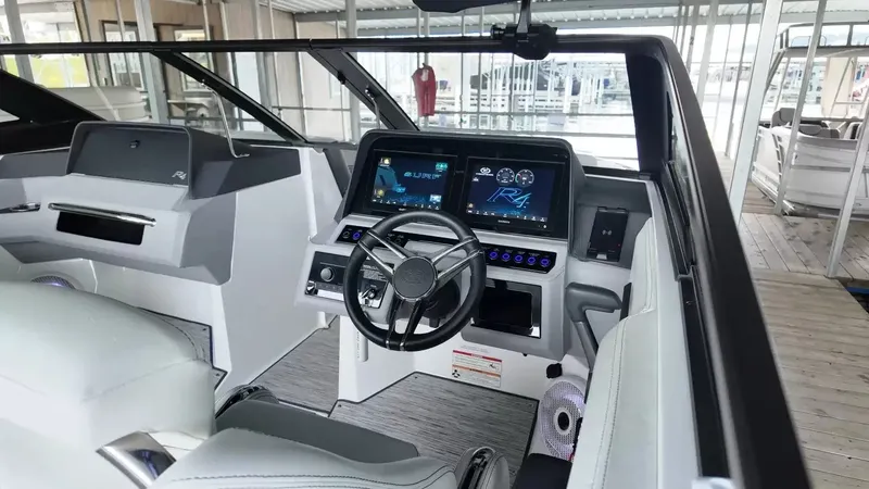 Slide: The Image of The cockpit of the 2026 Cobalt R4 Surf features a modern dashboard with two screens and a sleek steering wheel. - 26
